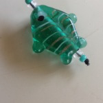 green glass fish bead on bookmark